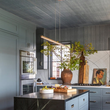 Modern 50 Inch Linear Suspension Fixture by Visual Comfort in Two Tone Antique Brass finish, kitchen island lighting.
