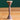 Horn Rattle by Eguchi Toys, on a green background