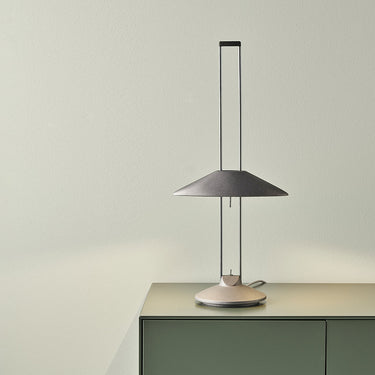 Side view of the B.lux Regina T halo lamp showing its open twin-stem structure and round base