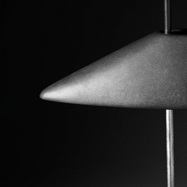B.lux Regina T illuminated at night, aluminium shade glowing against a dark background