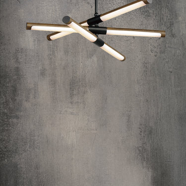 ET2 Rollo tube pendant against a mottled gray concrete wall, seen from below