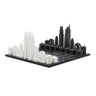 Acrylic Los Angeles architecture chess pieces by Skyline Chess on the wood map board