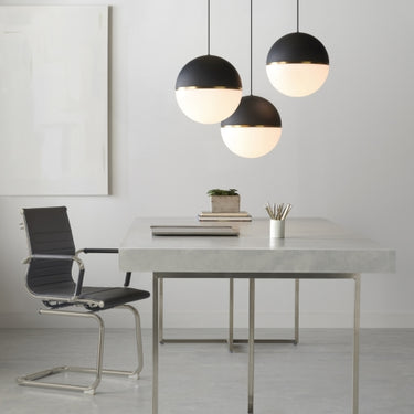 Visual Comfort Modern Akova Grande pendant fixture showcased in boutique hotel lobby entryway in matte black finisg