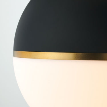 Close-up of acrylic diffuser on Akova Grande pendant highlighting smooth finish and soft ambient lighting