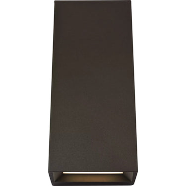 Pitch 12 angled outdoor wall light glowing on a modern facade