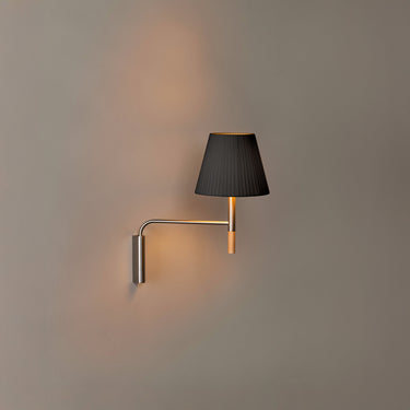 Santa & Cole BC hardwired wall sconce featuring black ribbon shade and satin nickel finish in contemporary interior