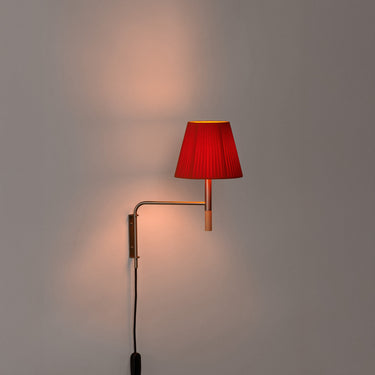 BC Swing Aram Wall Sconce with red amber ribbon shade and warm LED lighting for modern interiors