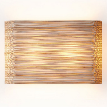 Close-up detail of Graypants Skew blonde recycled cardboard texture, handmade sconce.