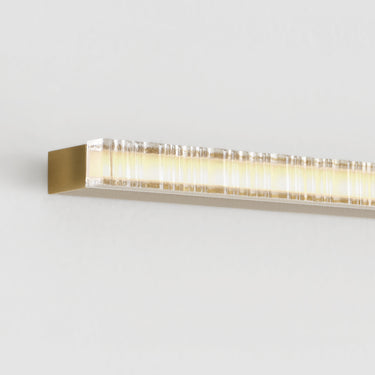 Commercial-grade 36 inch integrated LED vanity light in natural brass finish
