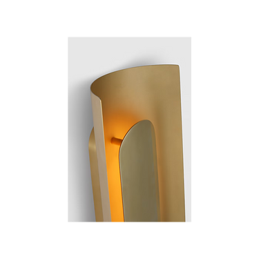 Luxury brass wall sconce with soft ambient lighting for modern interiors