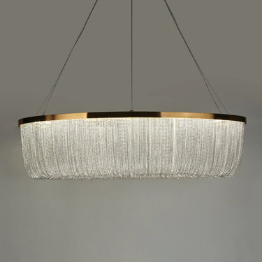 Brass Shoebill Rainfall Chandelier hanging in a contemporary living room