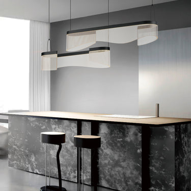 ET2 Sonata 3-Light curved acrylic channel pendant over a dark marble kitchen counter with black stools