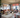 Visual Comfort Spectica chandelier with hanging stem and slope ceiling mount, living room setting