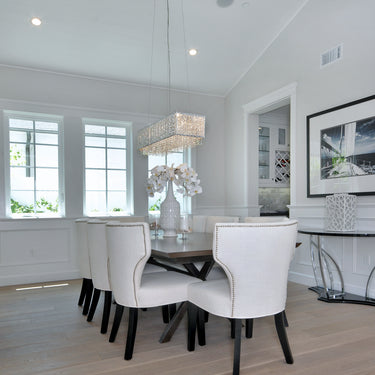 ET2 Spiral crystal drum pendant over a dining table in a tall room