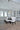 ET2 Spiral crystal drum pendant over a dining table in a tall room
