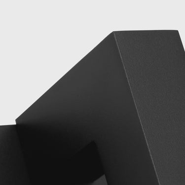 Slim architectural LED wall sconce with backplate for hallways and commercial spaces