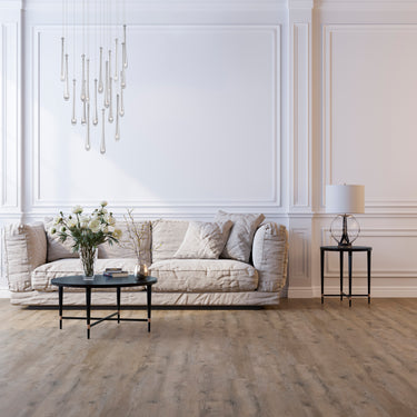 ET2 Stillo teardrop glass pendant cluster hanging over a white sofa in a paneled living room