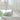 ET2 Stillo teardrop glass pendants cascading beside a white curved staircase with a glass railing