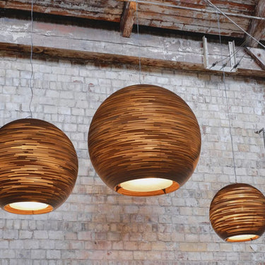 Large Graypants Scraplights Sun pendant installed in a bright commercial office space. 