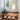 ET2 Swank acrylic orb pendant in a bathroom with a vanity and round mirror