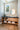ET2 Swank acrylic orb pendant in a bathroom with a vanity and round mirror