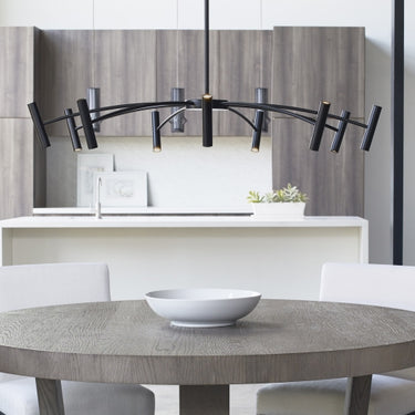 Visual Comfort Aerial 55" Black Chandelier Above a Dining Room Table