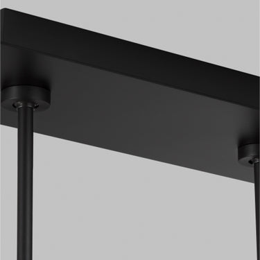 Geometric metal plates of the Bau 50 linear pendant light in Nightshade Black, creating a modern architectural focal point.