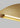 Natural Brass Bau 50 linear pendant light with integrated LED lighting, providing a soft, ambient glow.