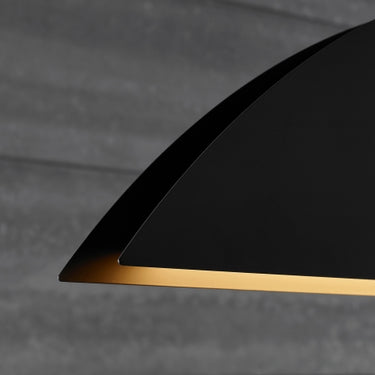 Bau 50 linear pendant light in Nightshade Black illuminating a modern dining room.
