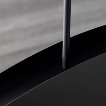 Nightshade Black Bau 50 linear pendant light with integrated LED lighting, providing warm ambient illumination.
