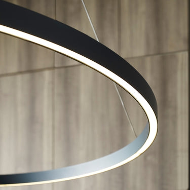 Sleek matte black LED ring pendant fixture from Visual Comfort, mounted on high ceiling
6.