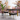 Luxury artisan-made Timber side table in black finish featuring natural wood top and brass detailing