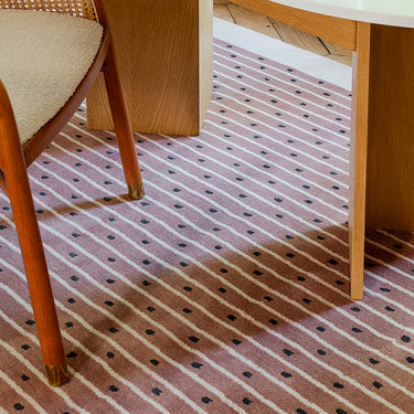 Exclamation wool rug in Bois de Rose, styled in a room