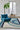Josep recycled polyester rug in Céladon, styled in a room