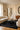 Amalgame wool rug in Black, styled in a room