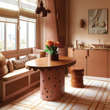 Eclisse wool rug in Yellow, styled in a room