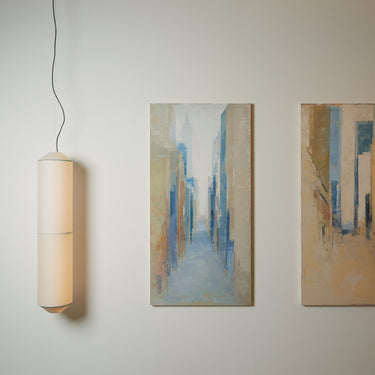 Tekio Sculptural vertical pendant light with soft ambient glow