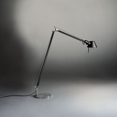 Italian designer floor lamp with rotating arm and tiltable head for bedroom or office lighting