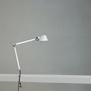 Contemporary Tolomeo Mini architect-style task lamp with adjustable head on work desk