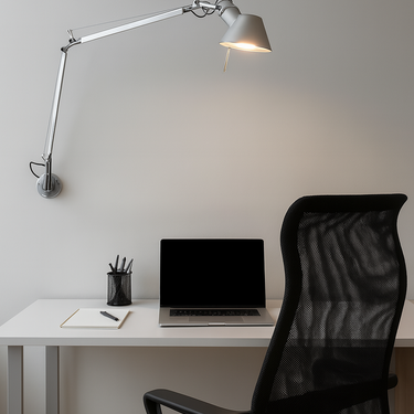 Tolomeo Classic TW wall lamp with tunable white LED and adjustable aluminum arm mounted in a modern office workspace
