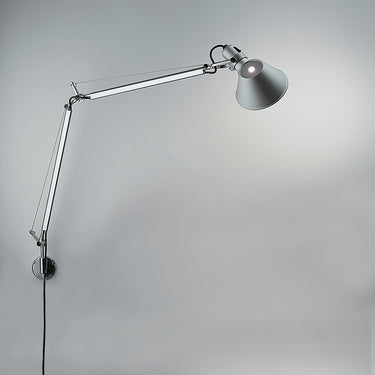 Tolomeo wall-mounted task light with adjustable aluminum arms and 360° rotatable shade for modern interiors