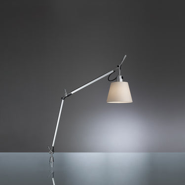 Italian-made Tolomeo lamp with warm fabric diffuser and pivoting shade for stylish desk decor