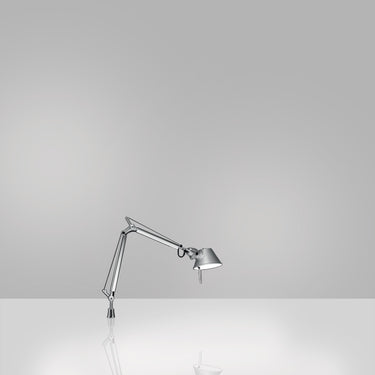 Tolomeo Micro LED desk lamp by Artemide showing articulated arm and tilting head