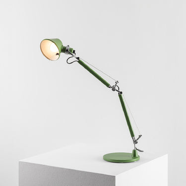 Tolomeo Micro table lamp by Artemide in matte yellow. Adjustable arm and direct task lighting for desks, bedrooms, and workspaces.