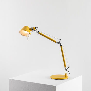 Tolomeo Micro table lamp by Artemide in matte yellow finish with adjustable articulated arm