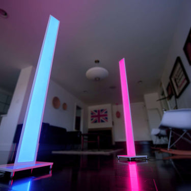 Color-wash LED floor lamp creating decorative wall lighting effects