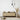 ET2 Torch tube pendants at different heights over a wood sideboard with dried grasses and ceramics