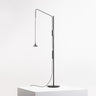 Unterlinden adjustable LED floor lamp by Artemide in black aluminum with swivel arm