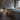 Astep Upglas T2 table lamp, pair of green lamps beside a bed