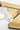Midrand Crystal 15 Vanity by Sean Lavin in Hand-Rubbed Antique Brass, close view of a cone and crystal diffuser